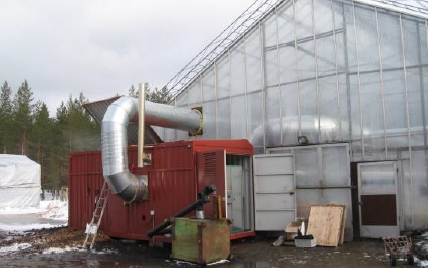 Greenhouse heating with a biomass-fired hot air generator